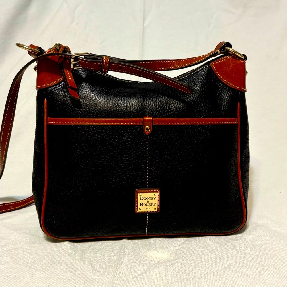 Dooney & Bourkey , gentle used,zippers work, in good shape,clean.